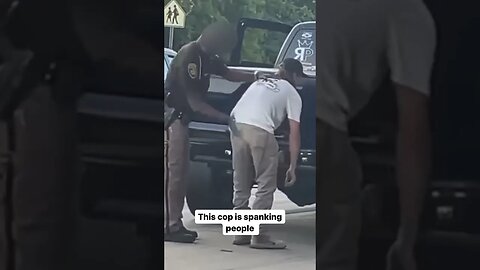 This cop is spanking people