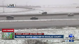 Snow and wind snarl travel across much of Colorado