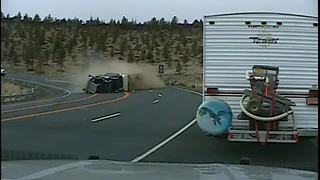 Semi truck rollover caught on police dash cam