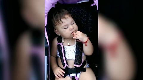 Toddler Girl Falls Asleep While Eating A Snack