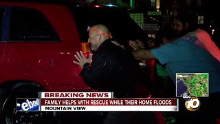Family helps with water rescue while own home floods