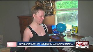 Town and Country neighbors surveying damage