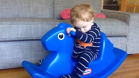 "Little Boy Loves Sleeping On A Rocking Horse"