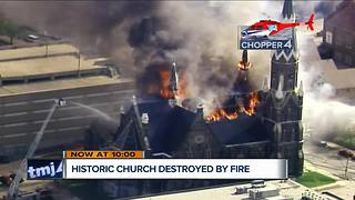 Witnesses watch as Trinity Lutheran burns from the Milwaukee skyline