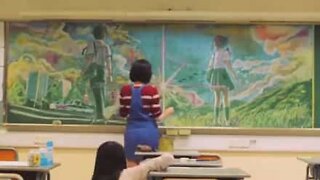 Students draw amazing chalk picture on a black board