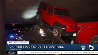 Vehicle carrier becomes stuck under I-5 overpass