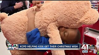 Kansas City police team up with children for biggest Shop with a Cop event