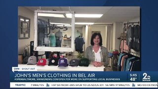 John's Men's Clothing says "We're Open Baltimore!"