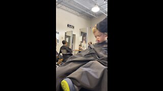 2 yr old falls asleep for his first salon haircut