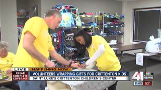Volunteers wrap gifts for Crittenton kids