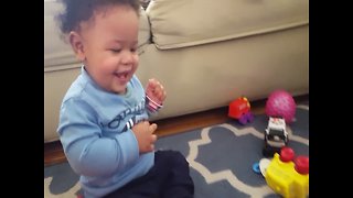 Baby gets a Case of the Giggles when Playing with Toy