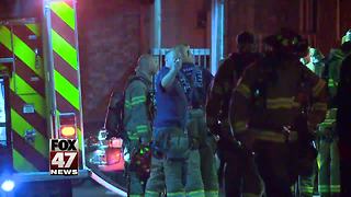 Investigators looking into apartment fire in Lansing