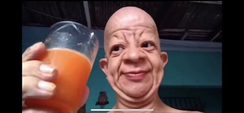 Wrinkly Old man drinking orange juice