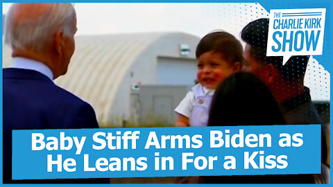 Baby Stiff Arms Biden as He Leans in For a Kiss
