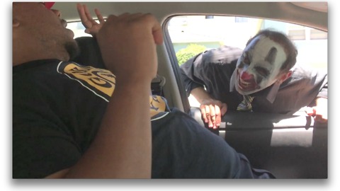 Man sleeping in car pranked by scary clown!