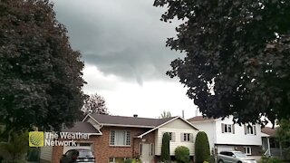 Funnel cloud hangs over neighbourhood