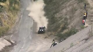 Racing vehicle literally comes inches from hitting spectator