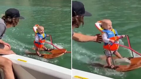 Three year old boy makes world record by surfing on the river