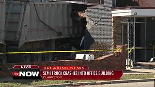 Driver hurt as semi truck crashes into dental office in downtown Clarkston