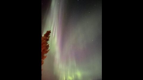 Northern lights and full moon