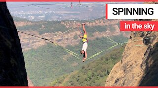 Adrenaline junky uses special slackline to spin around 164 feet in the air
