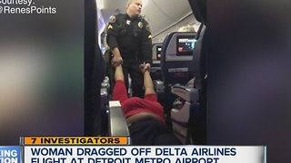 Woman dragged off plane at Metro Airport