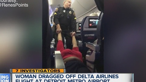 Woman dragged off plane at Metro Airport