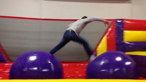Hilarious Dad Fails Gloriously At Bouncy Obstacle Course