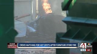 Crews begin investigation into three-alarm fire at furniture warehouse