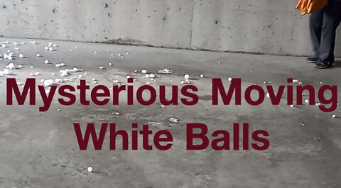Mysterious Moving White Balls on Garage Floor
