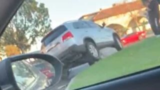 Driver parks car on top of a rock