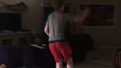 A Teen Boy Jumps On Yoga Ball And Falls