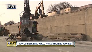 Top of retaining wall falls injuring worker