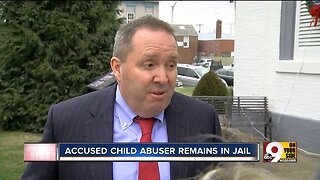 Accused child abuser to remain jailed awaiting trial