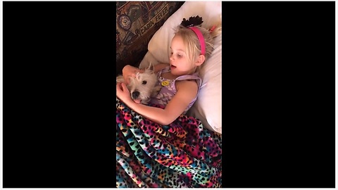 Little Girl Tries To Send Her Pup To Dreamland By Singing A Lullaby