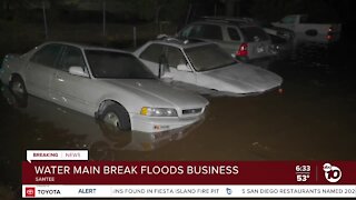 Broken water main floods Santee street, auto repair business