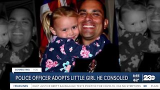 Police officer adopts little girl he consoled
