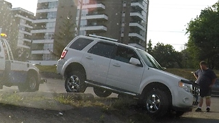 Skillful Tow Operator Frees Car From Unfortunate Parking Position