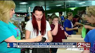 Filling backpacks for kids in crisis