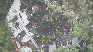 Firefighters search wreckage of Detroit house