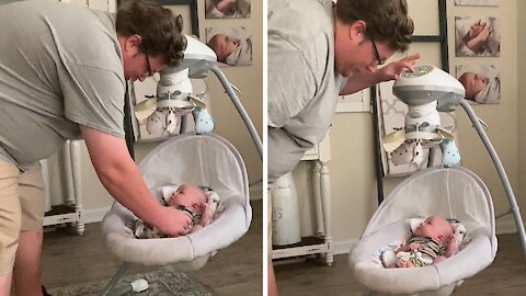 Dad Acts As Flight Attendant To Infant On Baby Swing