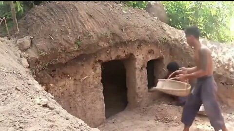 Primitive Build house Under Root. building technology in jungle