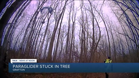 VIDEO: Paraglider gets stuck in tree in Wisconsin