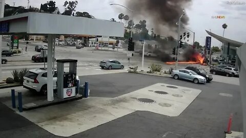 Car BURSTS into flames at LA intersection