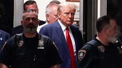 Donald Trump enters New York City courtroom following arrest processing