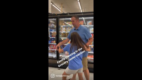 Family Dancing in Grocery Cooler Section