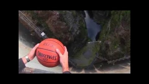 What Happens When a Spinning Basketball is Thrown Off a Dam!