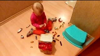 Candy. The little girl opened all the candy from the gift.