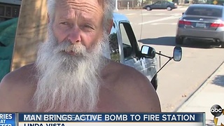 Man brings active bomb to fire station