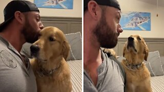 Man records dog's reaction after kissing him on the head